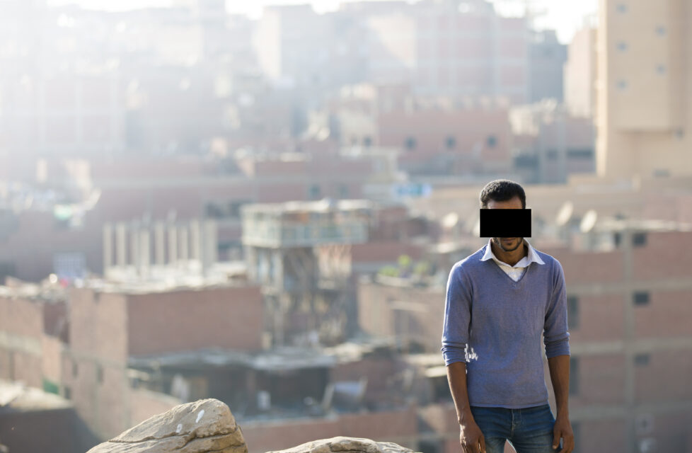 Radical Egyptian Muslim Stabs Christian, Later Comes to Faith A man stands on the outside of a city