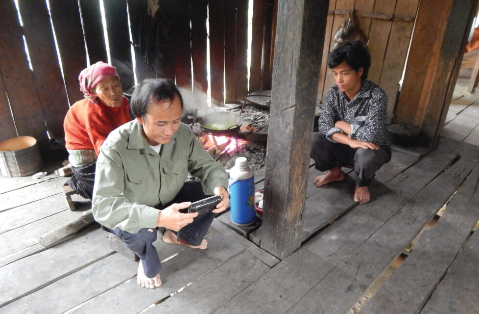 Vietnamese Believers Beaten for 3 Days, Do Not Deny Christ A family of three sit in their home reading